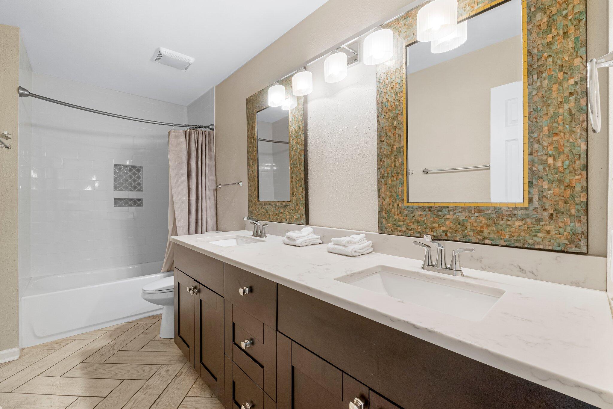 4984 West County Highway 30A Road, Unit 7B Santa Rosa Beach, FL 32459 - Photo 19 of 40 a bathroom with a tub sink and mirror