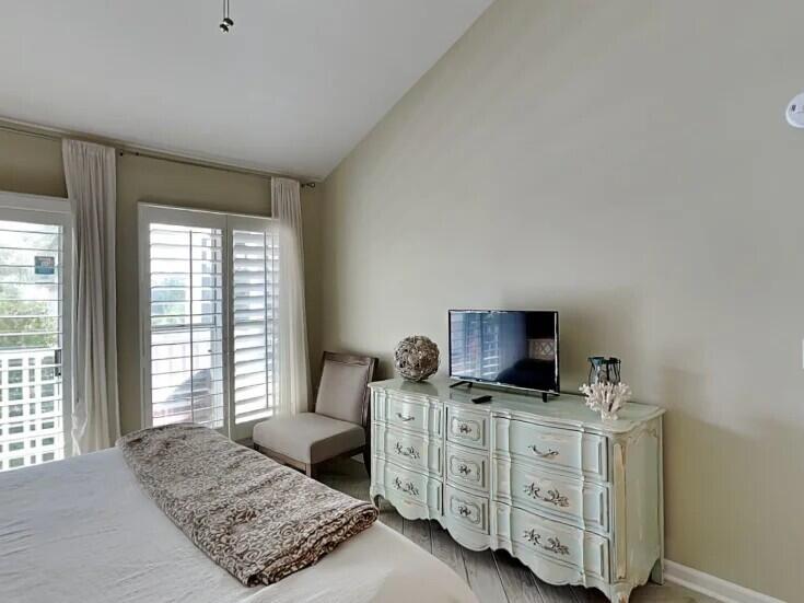4984 West County Highway 30A Road, Unit 7B Santa Rosa Beach, FL 32459 - Photo 21 of 40 a living room with furniture and flat screen tv
