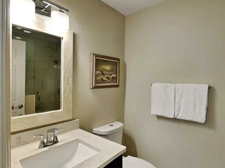 4984 West County Highway 30A Road, Unit 7B Santa Rosa Beach, FL 32459 - Photo 23 of 40 a bathroom with a sink mirror and vanity