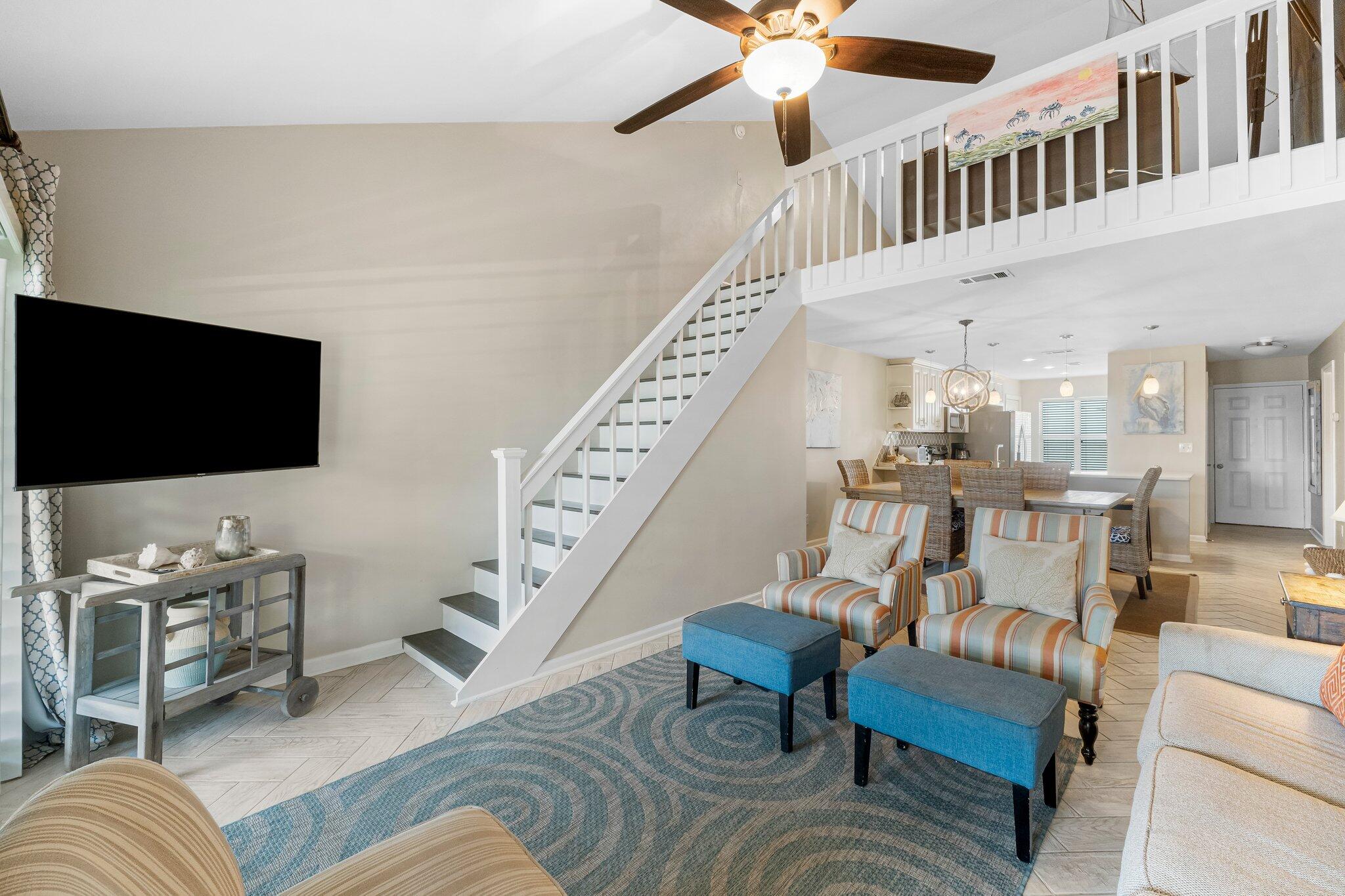 4984 West County Highway 30A Road, Unit 7B Santa Rosa Beach, FL 32459 - Photo 29 of 40 a living room with furniture and a flat screen tv
