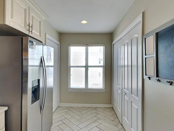 4984 West County Highway 30A Road, Unit 7B Santa Rosa Beach, FL 32459 - Photo 10 of 40 a view of a kitchen with a refrigerator cabinets and a window