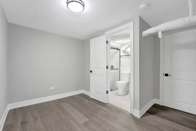 wooden floor and closet in a bathroom