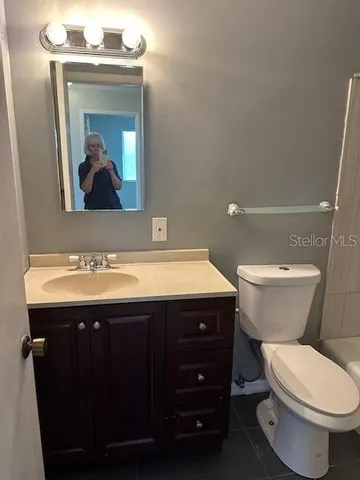 a bathroom with a shower and a toilet