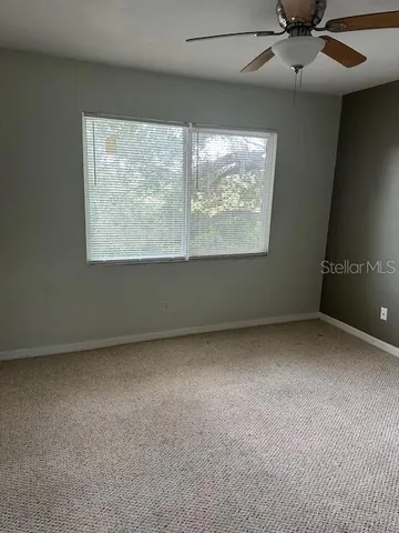 a view of an empty room with a glass door