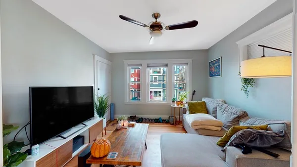 a room with furniture and a flat screen tv