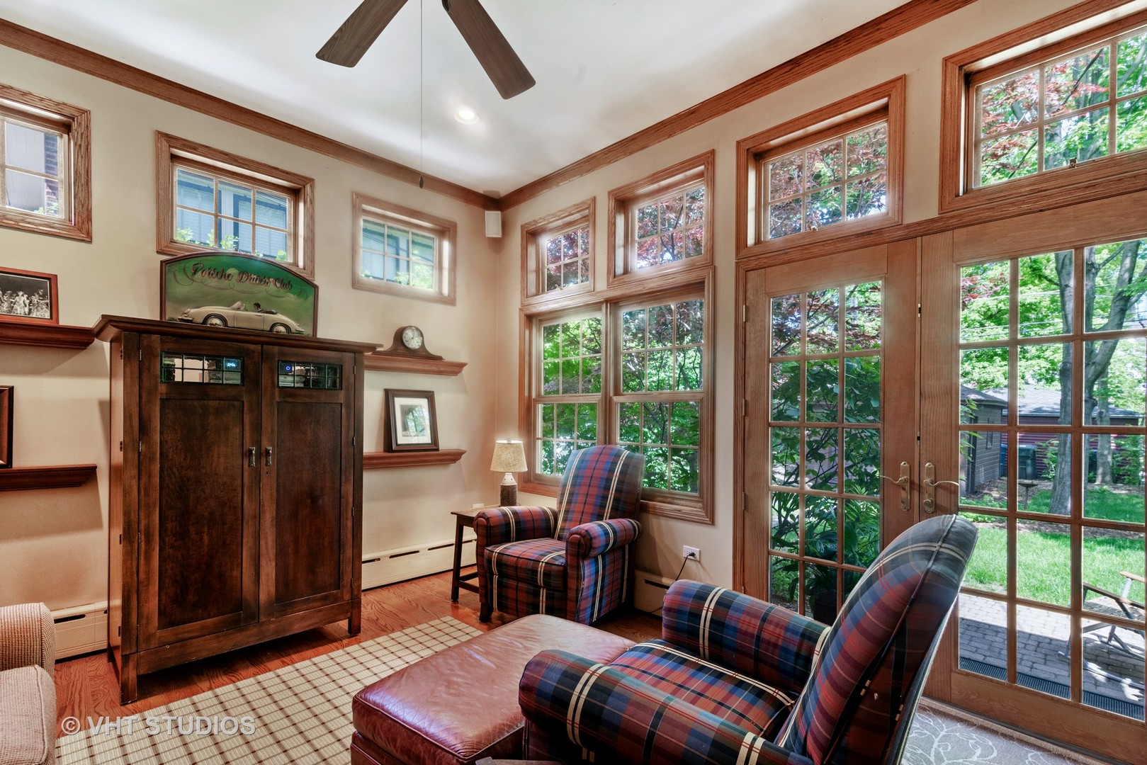 211 North Merrill Street Park Ridge, IL 60068 - Photo 12 of 26 a living room with furniture a floor to ceiling window and a flat screen tv
