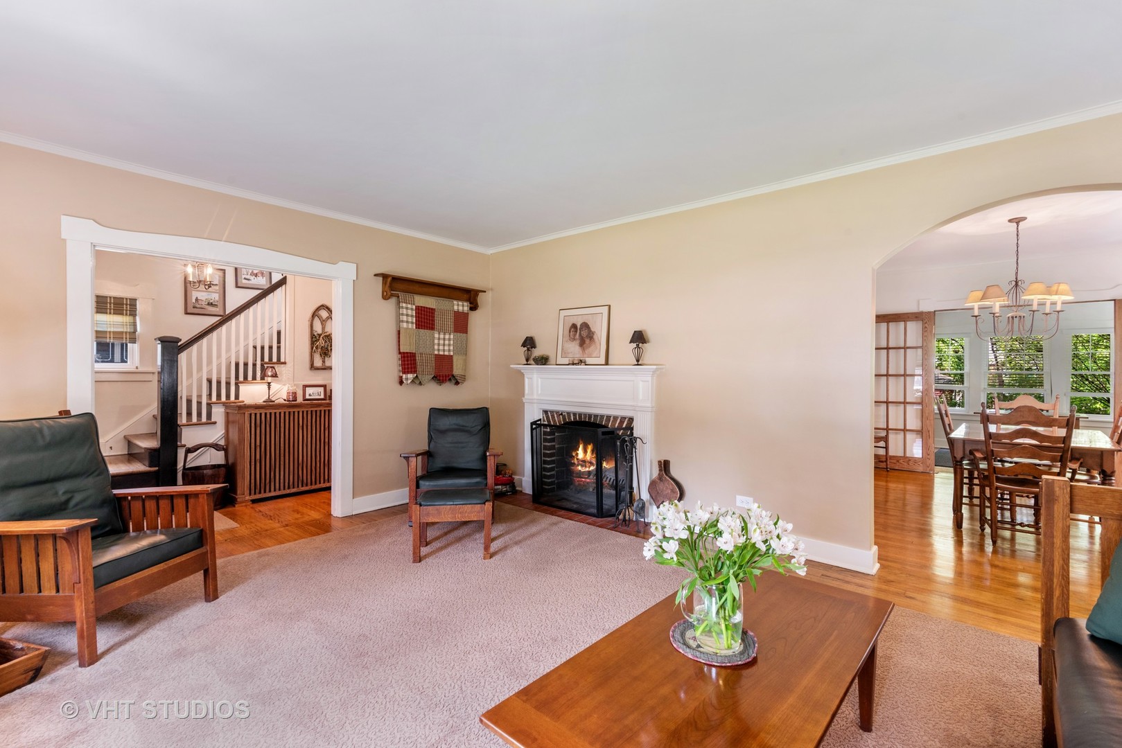 211 North Merrill Street Park Ridge, IL 60068 - Photo 3 of 26 a living room with furniture a fireplace and a potted plant