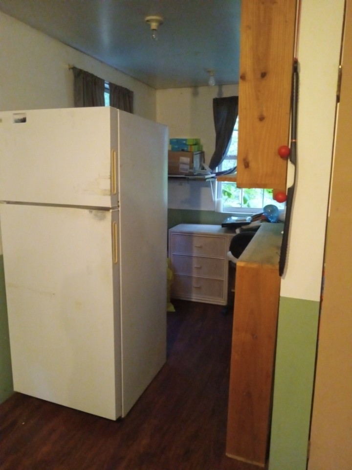 2185 Northcutts Cove Road Beersheba Springs, TN 37305 - Photo 21 of 24 a kitchen with stainless steel appliances a refrigerator and a stove