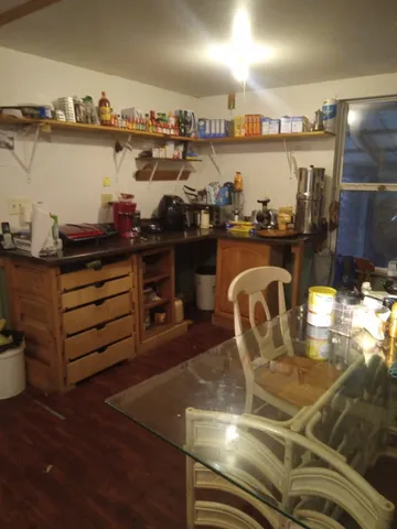 a bathroom with a toilet and a shower curtain