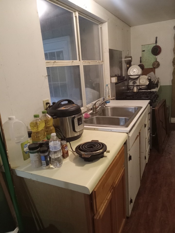 2185 Northcutts Cove Road Beersheba Springs, TN 37305 - Photo 24 of 24 a kitchen with a sink and cabinets