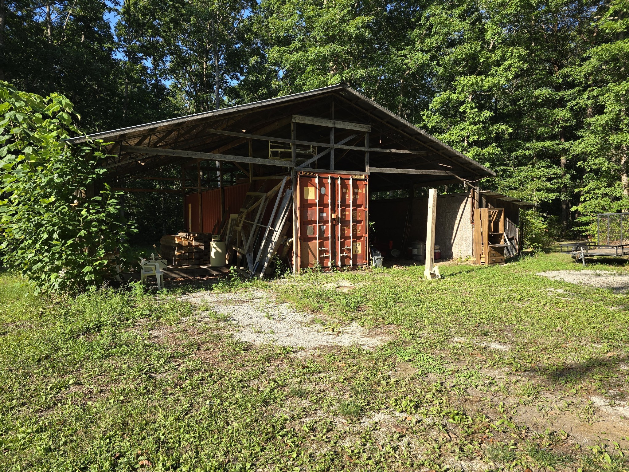 2185 Northcutts Cove Road Beersheba Springs, TN 37305 - Photo 6 of 24 a view of a wooden house with a yard
