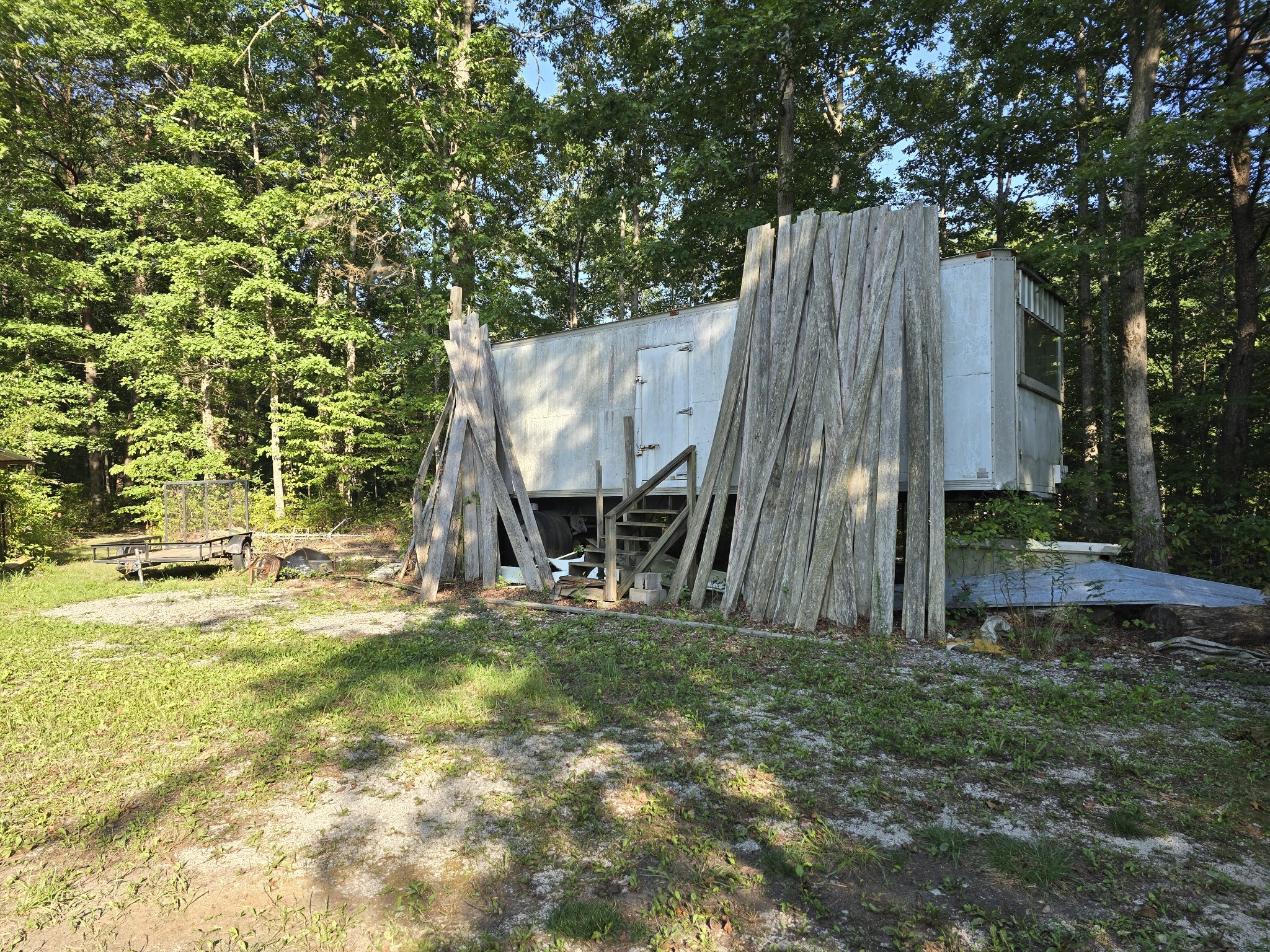 2185 Northcutts Cove Road Beersheba Springs, TN 37305 - Photo 8 of 24 a view of a backyard with a tree and a slide