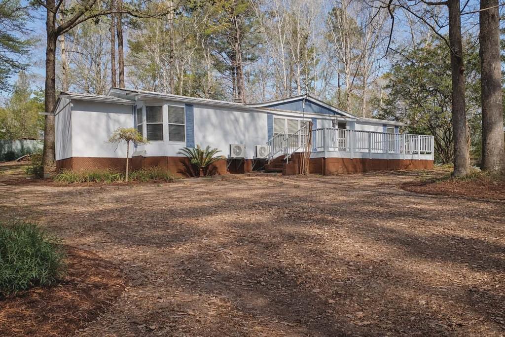 125 Sputnik Street Fortson, GA 31808 - Photo 1 of 30 a house that has a tree in front of it