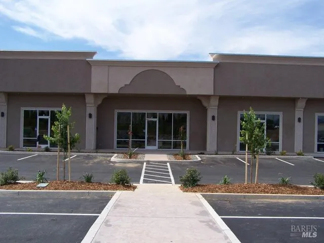 a front view of a house with sitting area