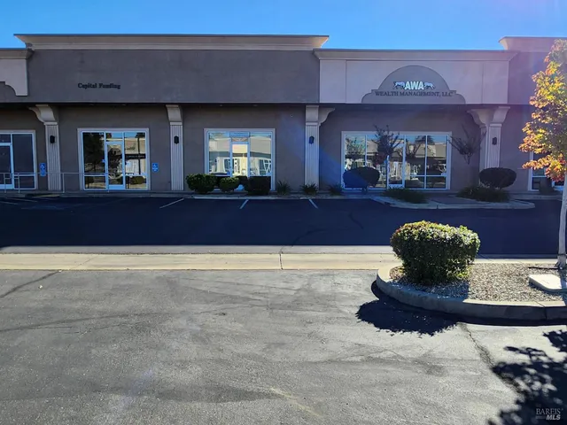 a view of a living room and chandelier