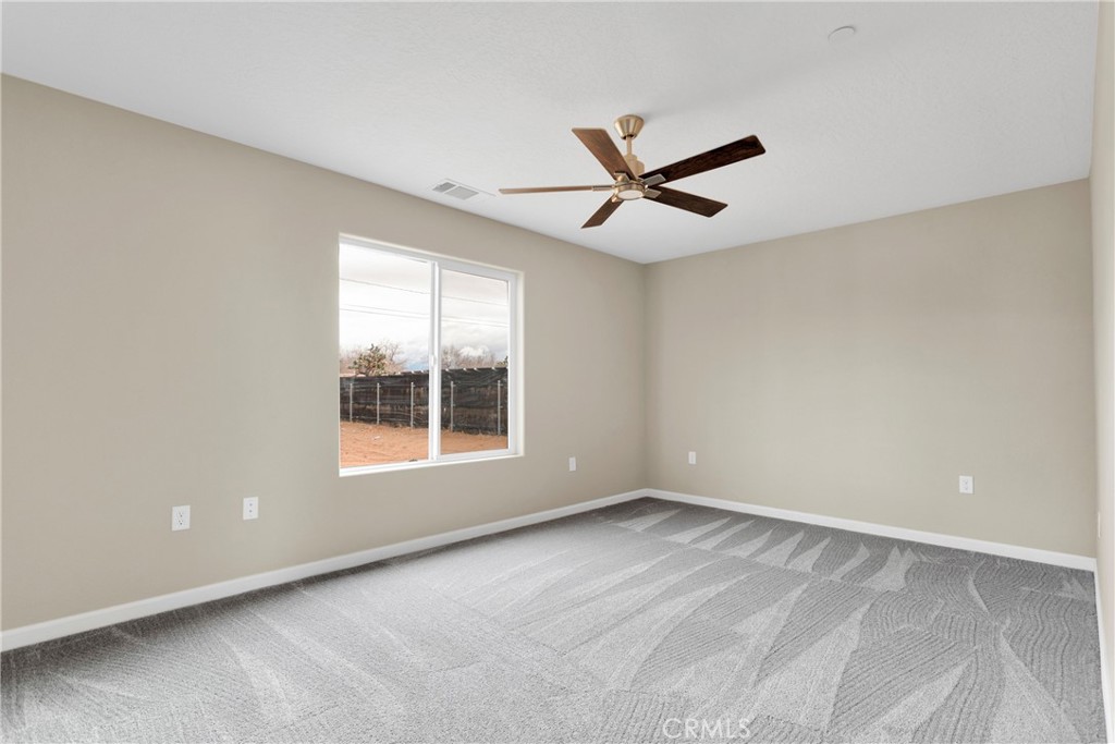 19375 Corwin Road Apple Valley, CA 92307 - Photo 16 of 27 a view of an empty room with a window