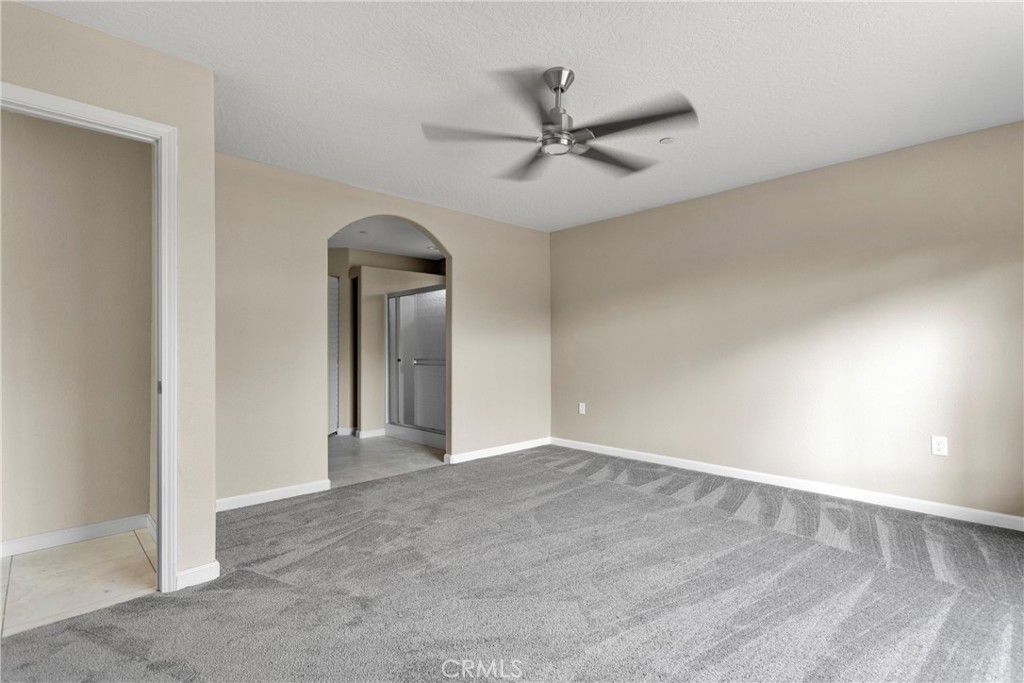 19375 Corwin Road Apple Valley, CA 92307 - Photo 19 of 27 a view of a hallway with a chandelier