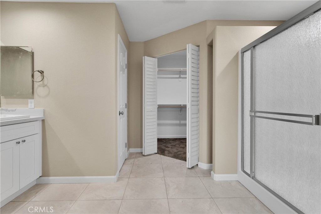 19375 Corwin Road Apple Valley, CA 92307 - Photo 23 of 27 a view of an empty room with a fireplace and a cabinet