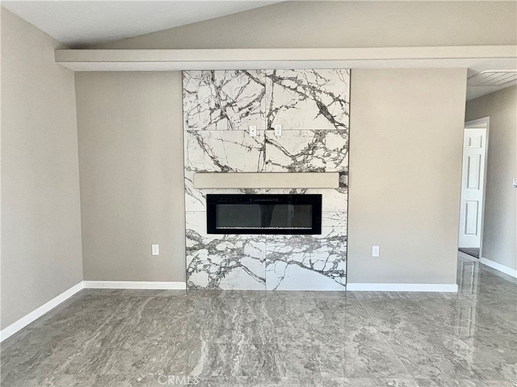 19375 Corwin Road Apple Valley, CA 92307 - Photo 6 of 27 a view of wooden floor with a fireplace