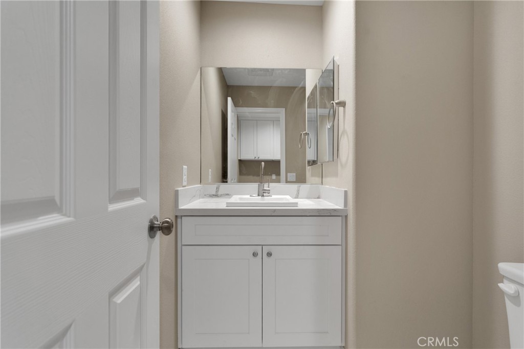 19375 Corwin Road Apple Valley, CA 92307 - Photo 8 of 27 a bathroom with a sink and a mirror