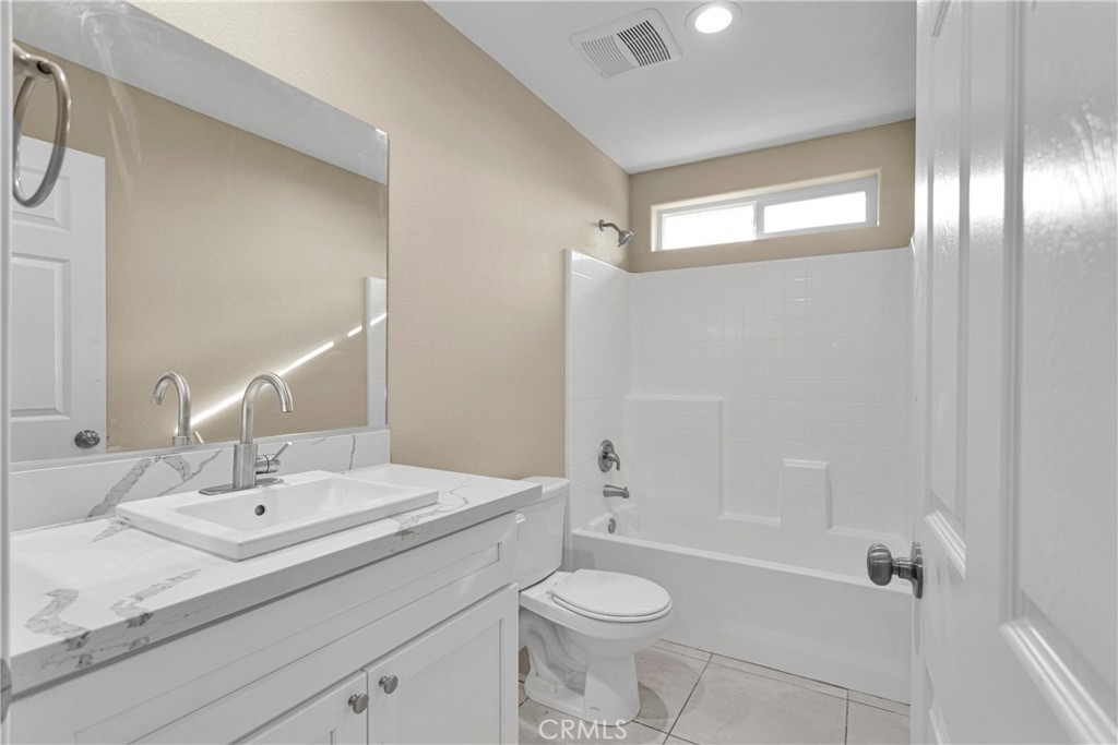 19375 Corwin Road Apple Valley, CA 92307 - Photo 10 of 27 a bathroom with a sink a toilet and shower