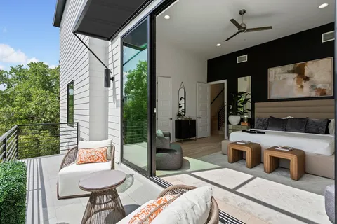 a view of a livingroom with furniture and flat screen tv