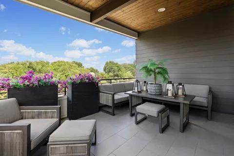 a outdoor living space with furniture and a potted plant