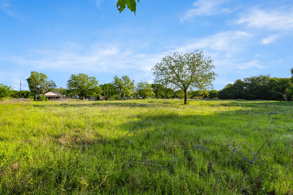 201 Proctor Lane Sunset, TX 76270 - Photo 18 of 18 a view of outdoor space with deck and yard