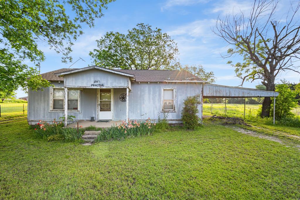 201 Proctor Lane Sunset, TX 76270 - Photo 3 of 18 front view of a house with a yard