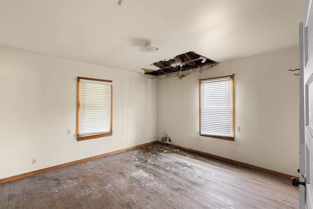 201 Proctor Lane Sunset, TX 76270 - Photo 8 of 18 an empty room with a window