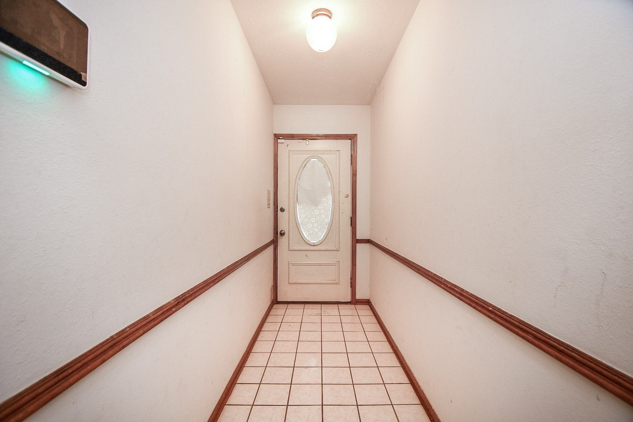 68 Alexander Court Angleton, TX 77515 - Photo 5 of 15 a view of a hallway with wooden floor and staircase