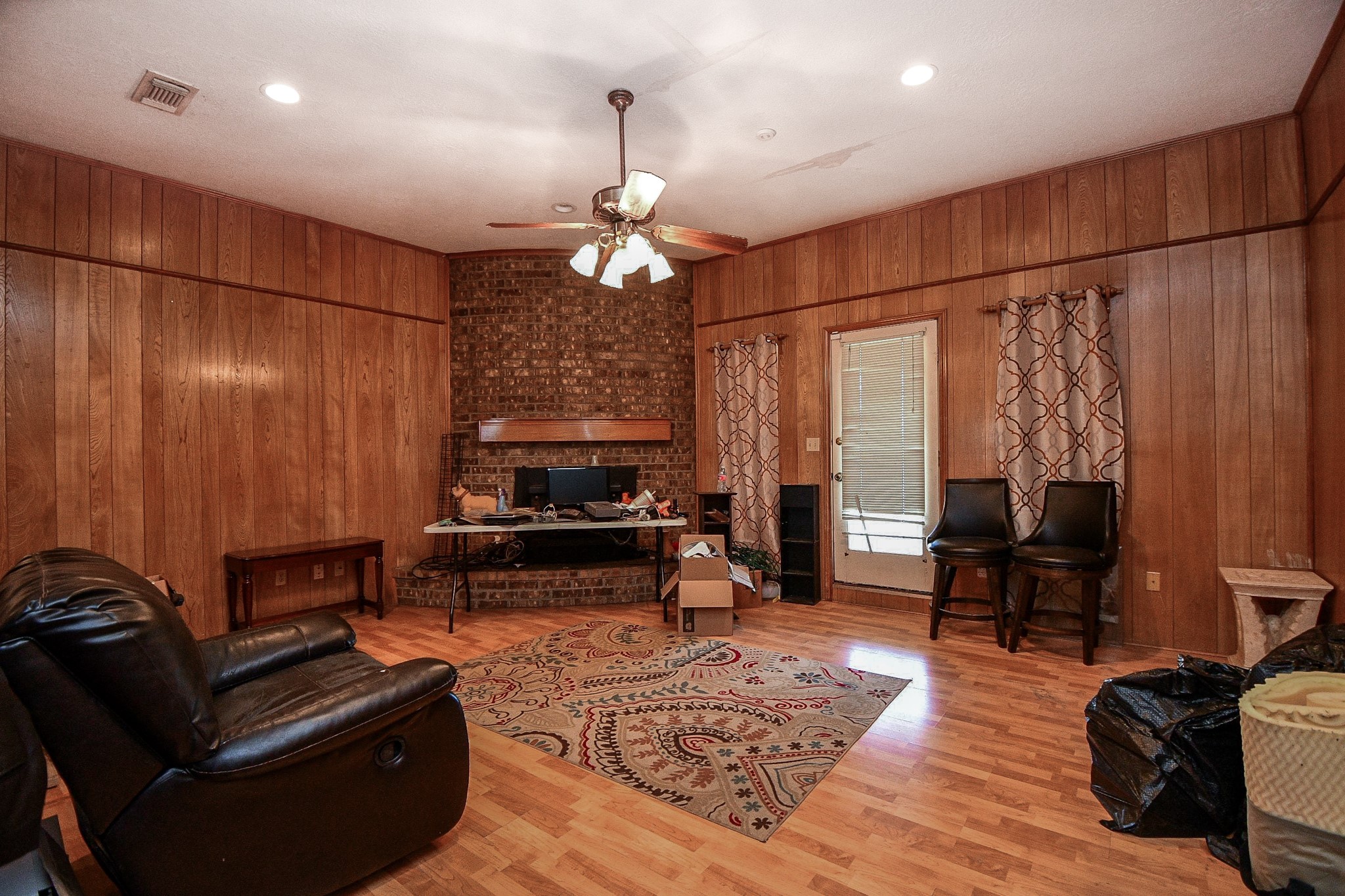 68 Alexander Court Angleton, TX 77515 - Photo 6 of 15 a living room with furniture and a chandelier