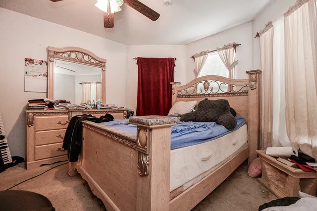 a front view of a house with a yard fire pit and outdoor seating