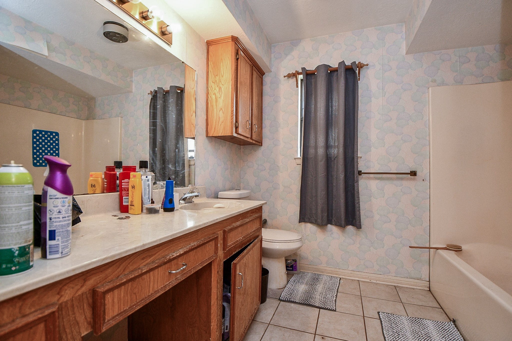 68 Alexander Court Angleton, TX 77515 - Photo 8 of 15 a bathroom with a sink a toilet and a mirror