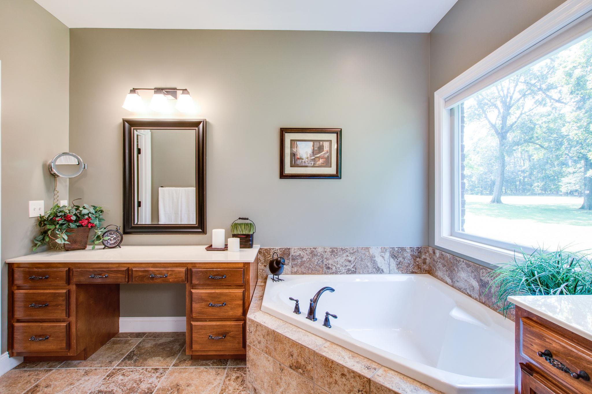 6629 Burnt Knob Road Murfreesboro, TN 37128 - Photo 12 of 27 Here's the garden tub that sits across from the large tiled shower. The second vanity area. There''s another walk-in closet to the left of view.