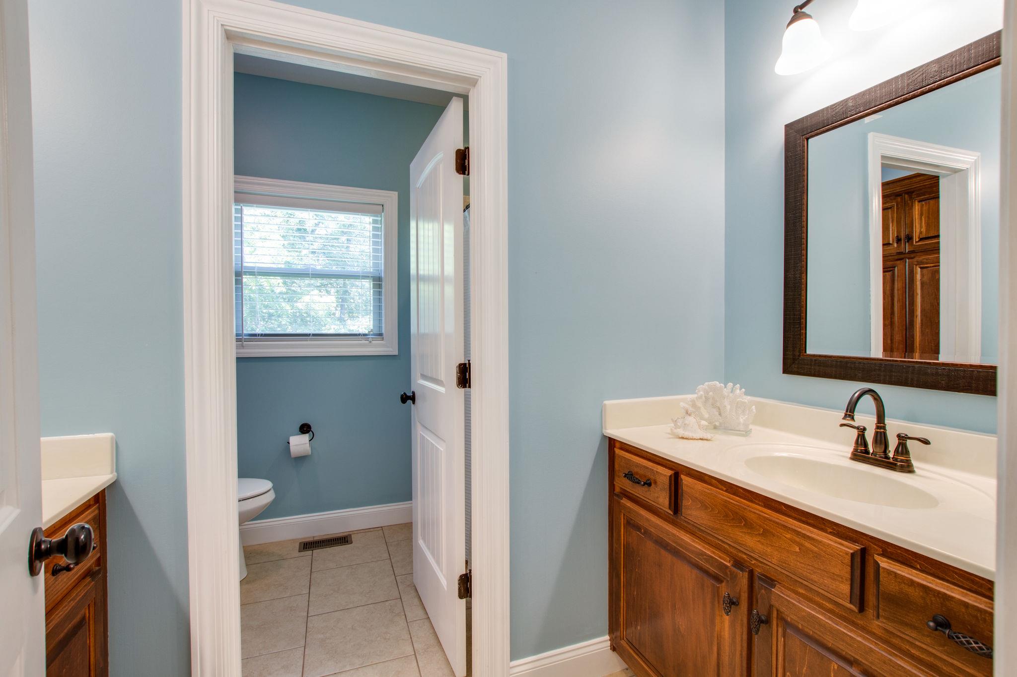 6629 Burnt Knob Road Murfreesboro, TN 37128 - Photo 22 of 27 Back downstairs to the hall bath that has two vanities. One is behind the door and is identical to the one you see here.