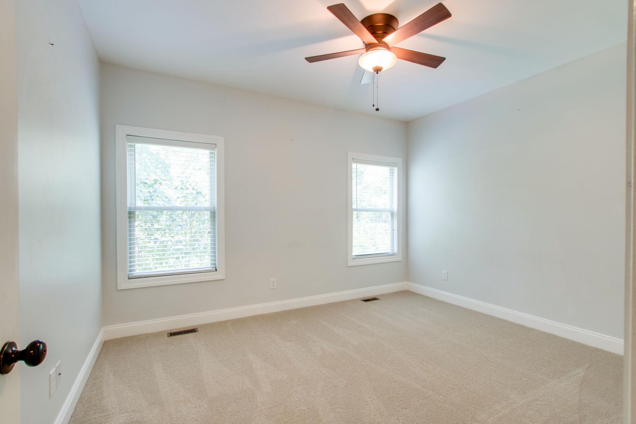 6629 Burnt Knob Road Murfreesboro, TN 37128 - Photo 25 of 27 Secondary bedrooms are on the far side of the home from the master and share a bathroom in the hall with two vanities.