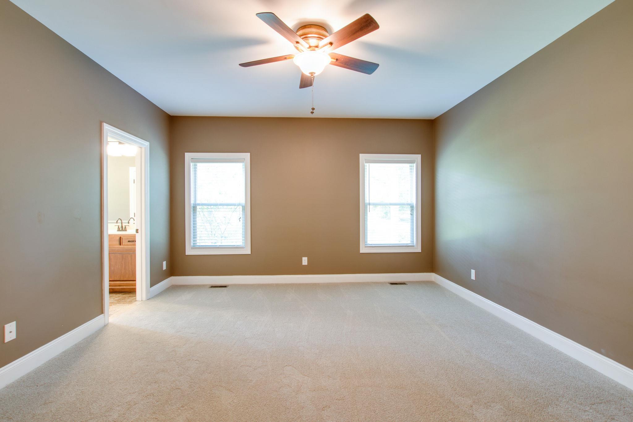 6629 Burnt Knob Road Murfreesboro, TN 37128 - Photo 26 of 27 Master bedroom is on main level. The windows overlook the back yard. Complete privacy. Two large walk-in closets.