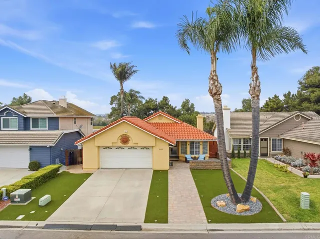 an aerial view of multiple houses with yard