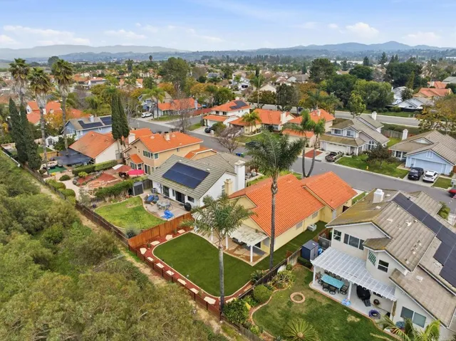 an aerial view of a house with a garden
