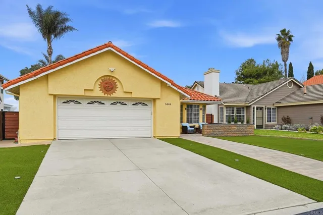 a view of a hallway with wooden floor and closet