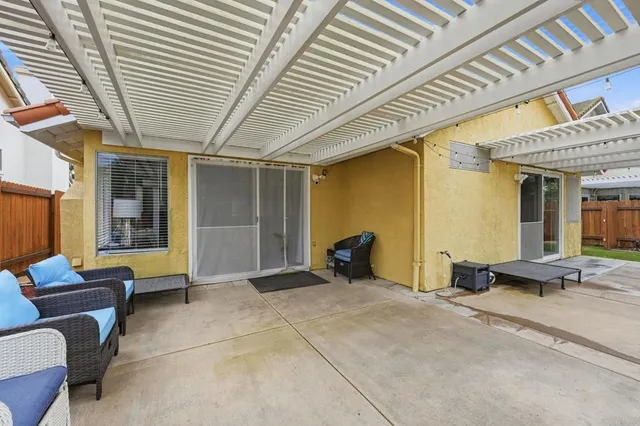 a view of the porch with furniture and a ceiling fan