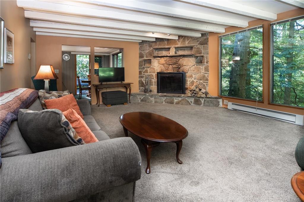 1223 Triple Creek Road Champion, PA 15622 - Photo 13 of 25 Grand Living Room with Phenomenal Views leads to Dining Room/Kitchen and Large Wrap Around Deck.