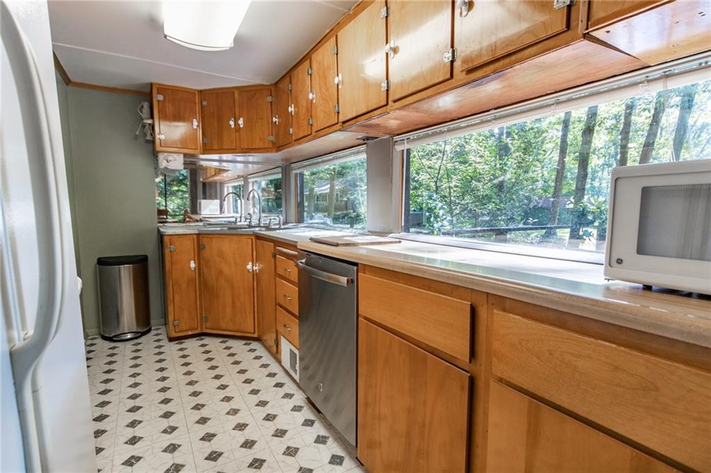 1223 Triple Creek Road Champion, PA 15622 - Photo 16 of 25 Kitchen Also Has a Wall of Windows. This Home Truly brings Nature Indoors from All sides!