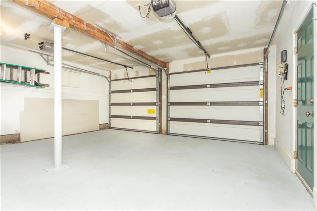 1223 Triple Creek Road Champion, PA 15622 - Photo 24 of 25 2 Car Attached Garage, with Man door to Covered Side Porch