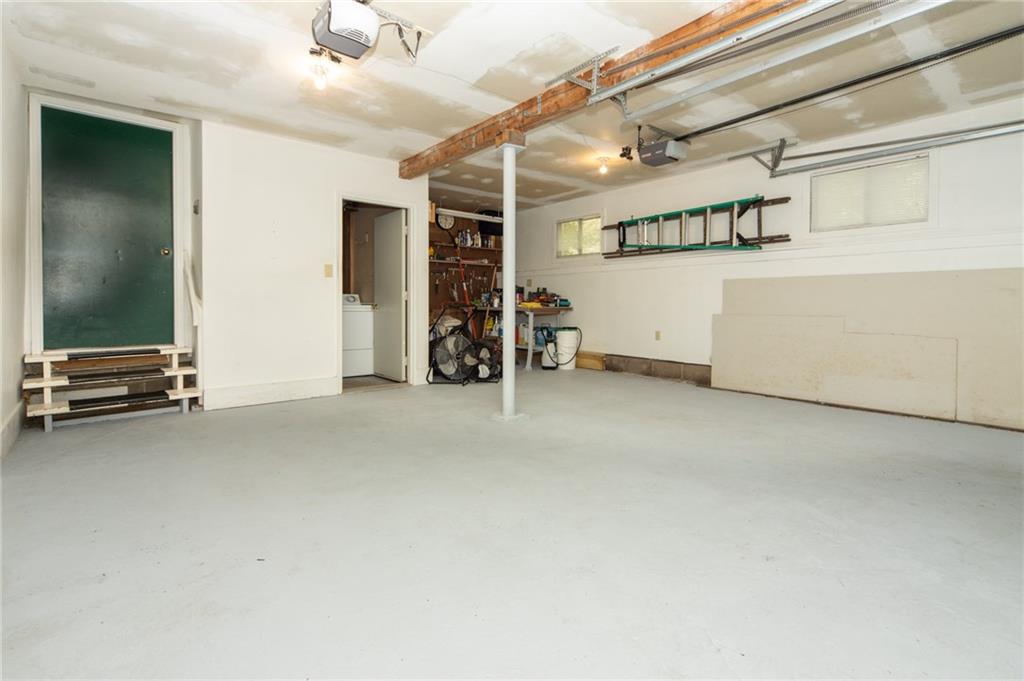 1223 Triple Creek Road Champion, PA 15622 - Photo 25 of 25 2 Car attached Garage with Laundry Room and Extra Storage Area.