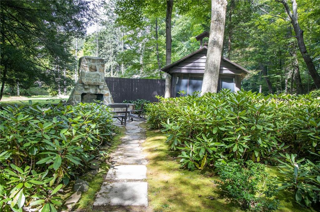 1223 Triple Creek Road Champion, PA 15622 - Photo 6 of 25 Laurel Gardens Path leading to the Massive Outdoor Stone Wood Burning Fire Place and Screened Pavilion Right along Fishing Run