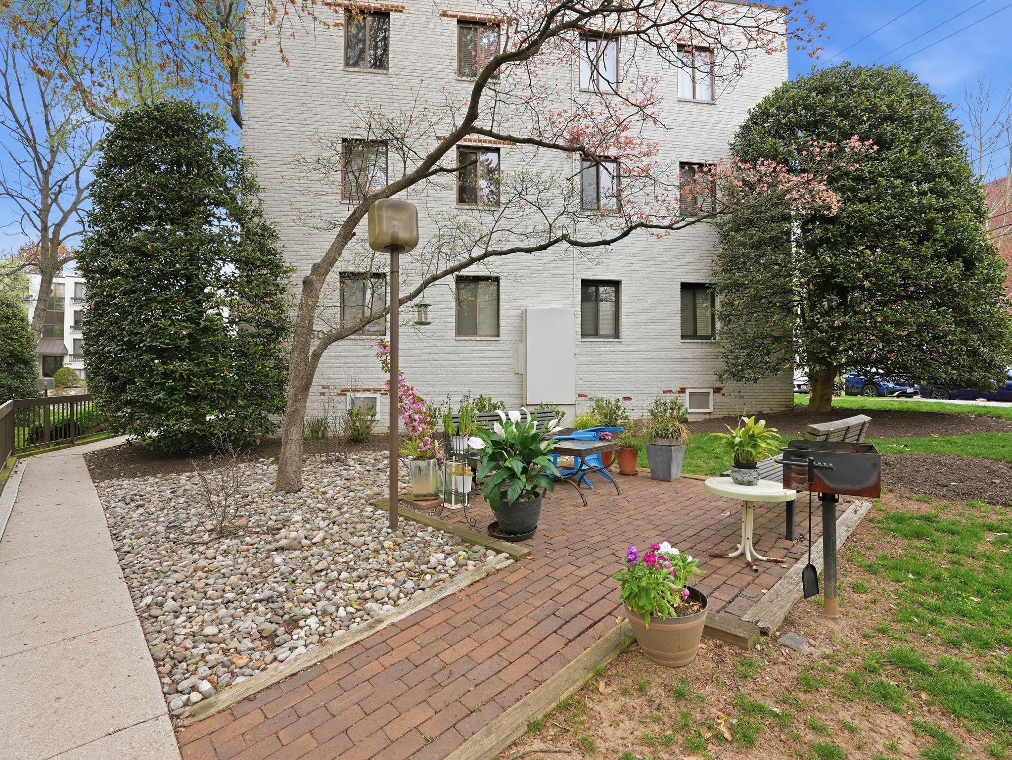 3835 Davis Place Northwest, Unit 2 Washington, DC 20007 - Photo 15 of 26 Multiple shared patio spaces with charcoal grills.