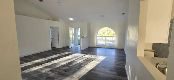 a view of livingroom with wooden floor