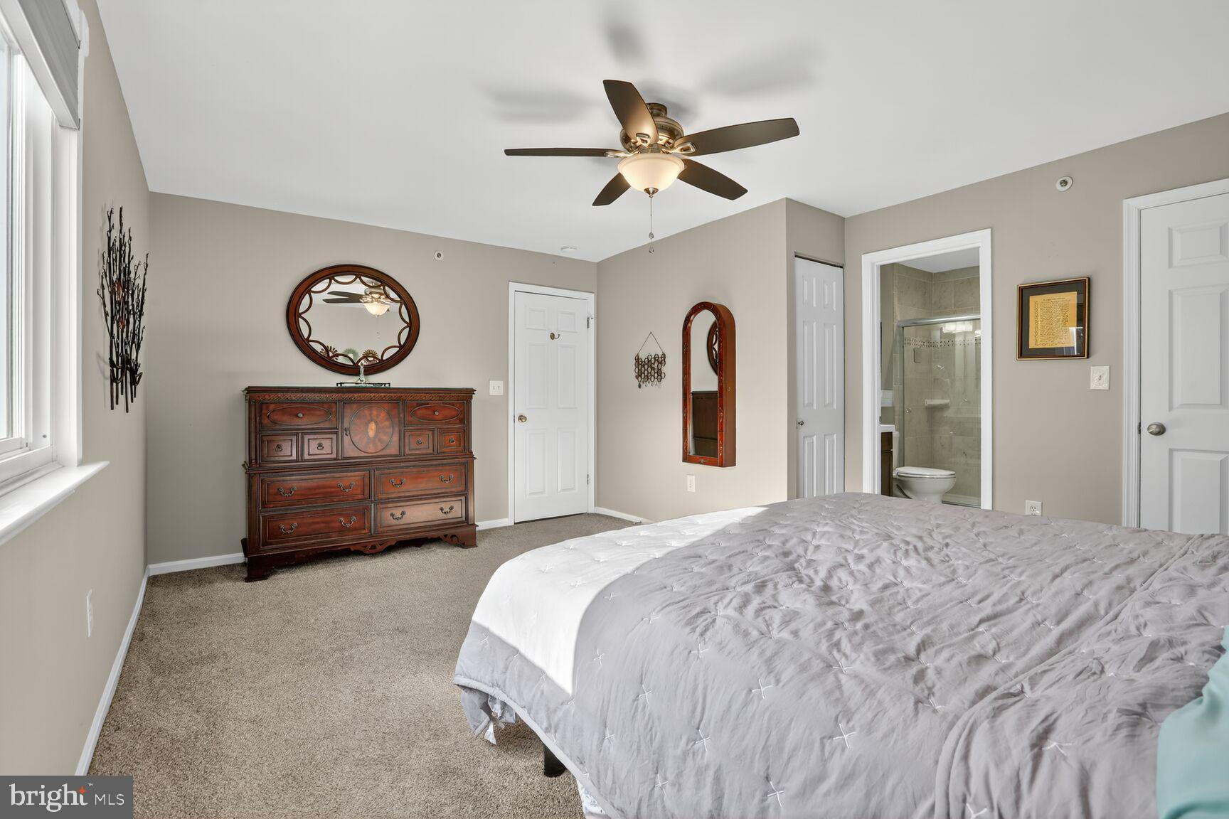 4106 Chardel Road, Unit 2G Baltimore, MD 21236 - Photo 18 of 25 a bedroom with a bed and a chandelier